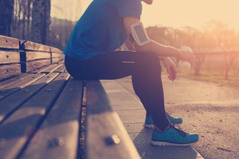 Runner sitting on a bench.