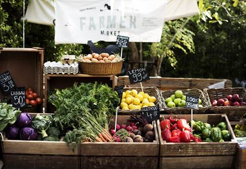 Fruits and vegetables displayed at farmer's market.