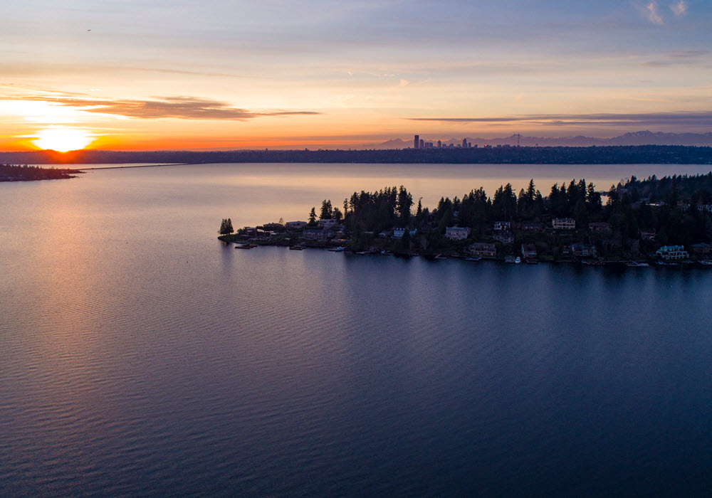 Aerial view of Lake Washington at sunset overlooking Bellevue and Seattle.