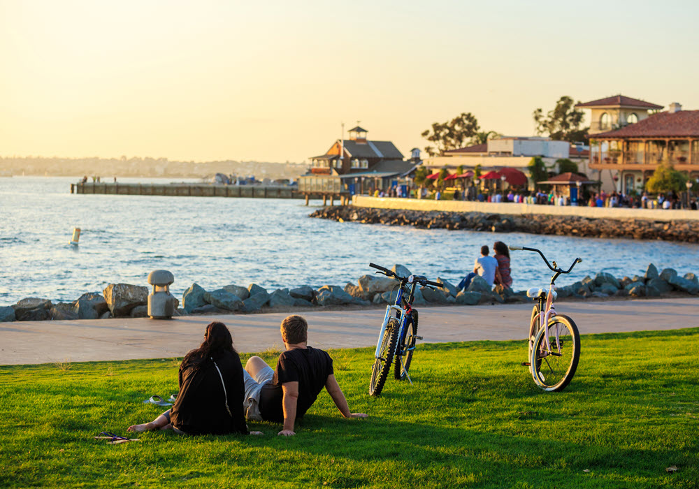 Couple taking a rest from a San Diego sunset bike ride.