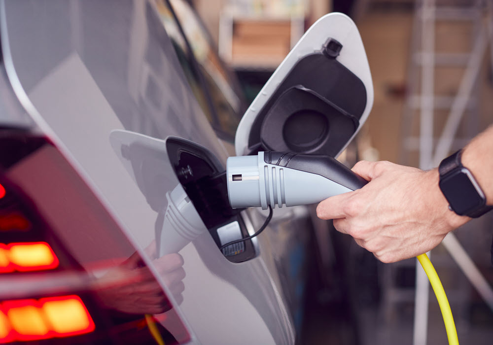 Charging an electric vehicle at home.