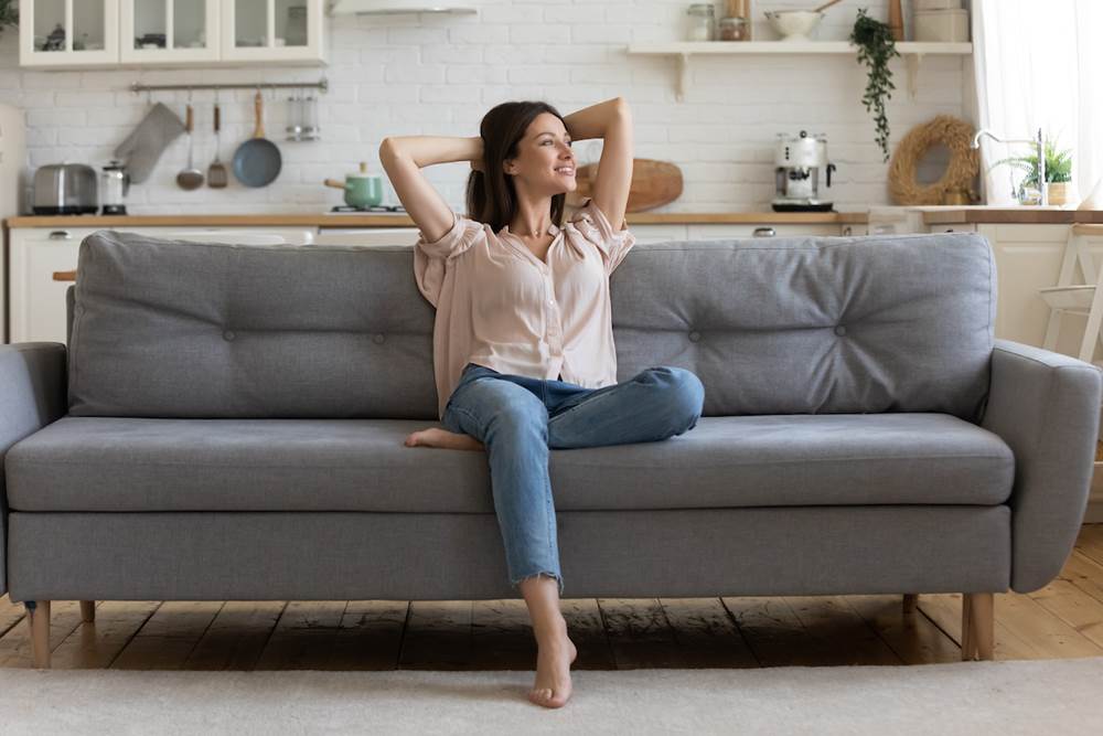 Thriving Solo: 10 Ways to Beat Loneliness in Single Living - Sitting on the couch alone