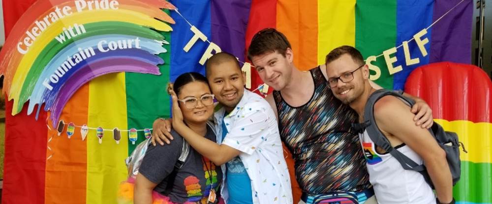 Diverse group of people celebrating pride.