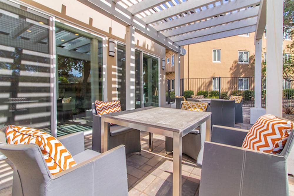 Sitting area under pergola.